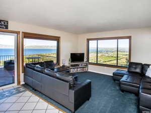 Living room with tile patterned floors and carpet flooring