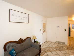 Sitting room with light tile patterned floors