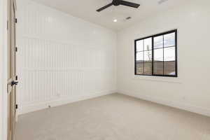 Empty room featuring carpet flooring, ceiling fan, and recessed lighting