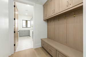 Mudroom featuring light wood finished floors