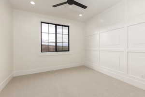 Carpeted spare room featuring recessed lighting and a ceiling fan