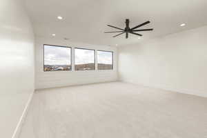 Unfurnished room with light colored carpet, recessed lighting, and ceiling fan