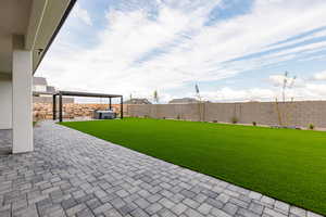 Fenced backyard with a patio area
