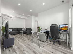 Office area featuring recessed lighting and light wood-style flooring