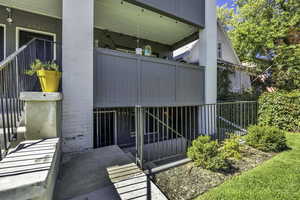 Entrance to property featuring brick siding