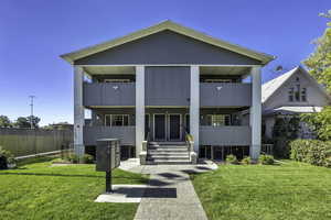 View of front facade with a balcony