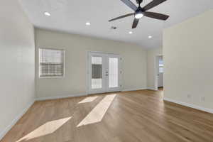 Unfurnished room featuring recessed lighting, french doors, light wood-style floors, and ceiling fan