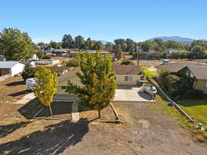 Aerial perspective of suburban area with a mountainous background