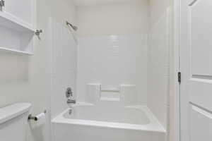 Full bathroom with shower / bathtub combination and toilet