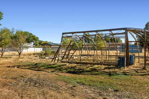 View of jungle gym with an outdoor structure