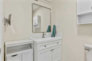 Bathroom with toilet and vanity