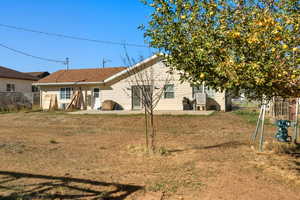 Rear view of property featuring a patio