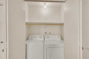 Washroom with washing machine and dryer