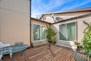 Wooden deck featuring entry steps