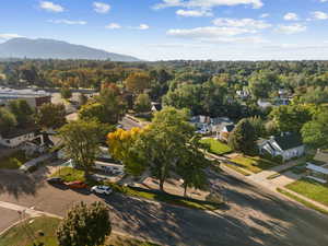 Aerial view of property's location with a mountainous background and nearby suburban area