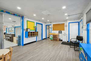 Miscellaneous room with recessed lighting and a textured ceiling