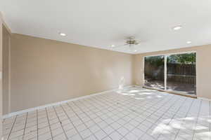 Spare room featuring tile patterned floors, recessed lighting, and a ceiling fan