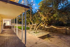 Fenced backyard with a patio