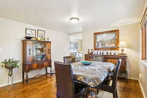 Dining room with hardwood / wood-style flooring