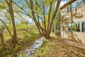 View of yard with a water view