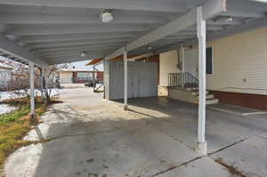 View of patio / terrace featuring an attached carport