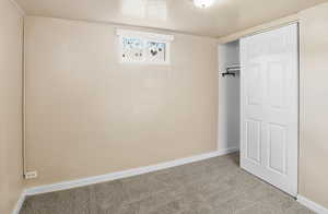 Unfurnished bedroom with carpet floors and a closet