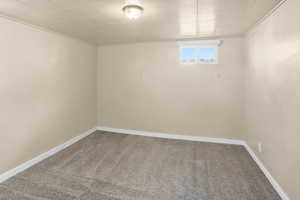 Spare room with carpet floors and baseboards