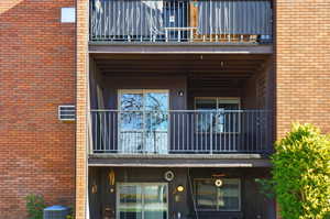 View of building exterior, 2nd floor unit balcony