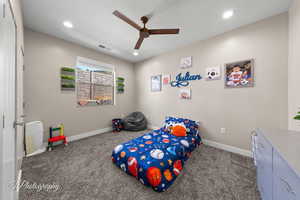 Bedroom with carpet floors, a ceiling fan, and recessed lighting