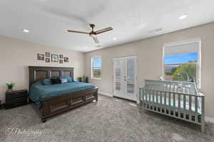Bedroom featuring carpet flooring, access to exterior, a ceiling fan, recessed lighting, and french doors