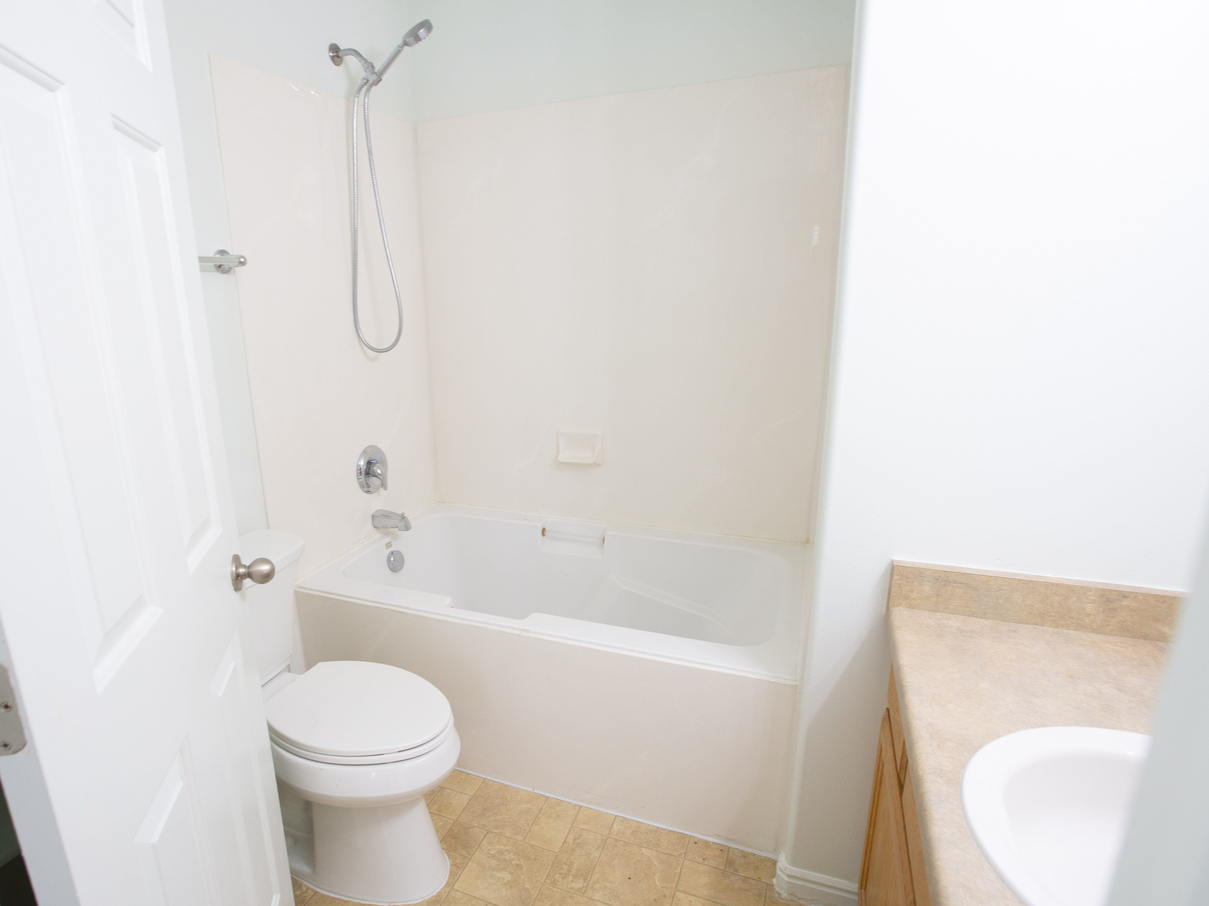 Bathroom with tub / shower combination and vanity