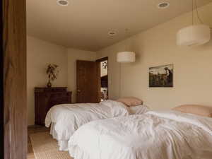Bedroom with wood finished floors and recessed lighting