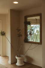 Detailed view of wood finished floors and recessed lighting