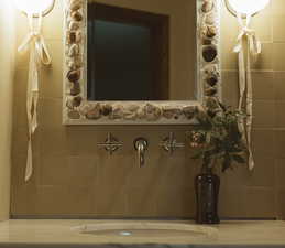 Bathroom featuring tile walls
