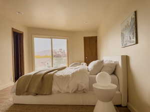 Bedroom with recessed lighting and wood finished floors