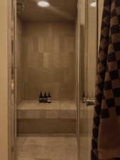 Full bathroom featuring a shower stall and recessed lighting