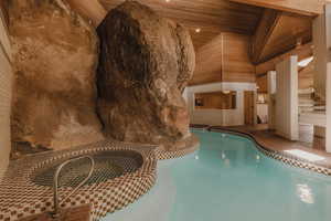 Indoor pool with a patio area