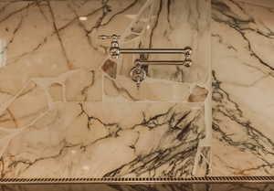 Bathroom view of a marble finish shower