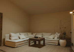 Living area featuring brick wall