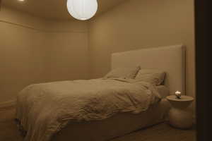 Bedroom with carpet and baseboards