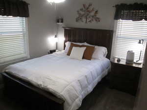 Bedroom with multiple windows