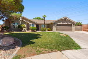 Ranch-style home with concrete driveway, stucco siding, a garage, and a tiled roof