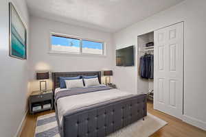 Bedroom featuring a closet and wood finished floors