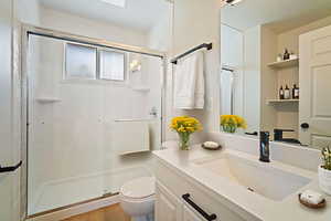 Bathroom featuring vanity and a stall shower