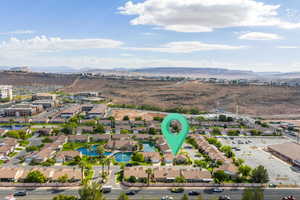 Aerial perspective of suburban area with a water and mountain view