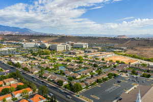 Aerial view of residential area featuring a mountainous background