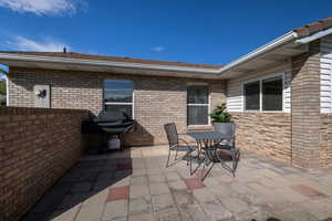 View of patio featuring grilling area and outdoor dining space