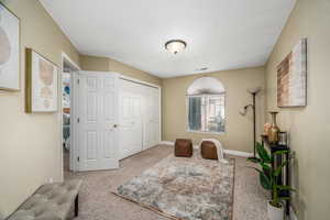 Sitting room with carpet flooring