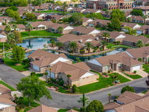 Aerial view of residential area featuring a large body of water