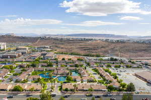 Aerial perspective of suburban area with a water and mountain view